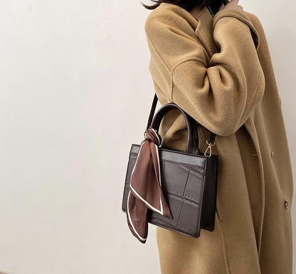 Clu - Elegante und klassische Handtasche