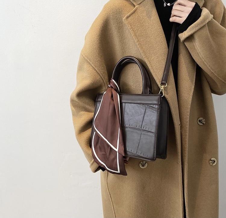 Clu - Elegante und klassische Handtasche