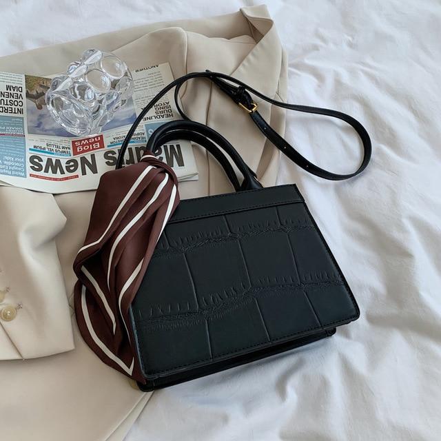 Clu - Elegante und klassische Handtasche